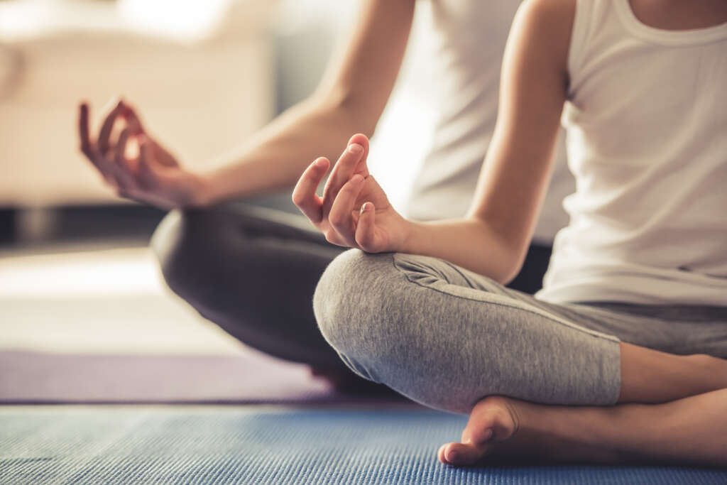 Two people doing yoga